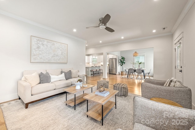 5305 Tarrywood Ln, Charlotte, NC 28205 - living room featuring a ceiling fan, recessed lighting, crown molding, and light wood-style floors