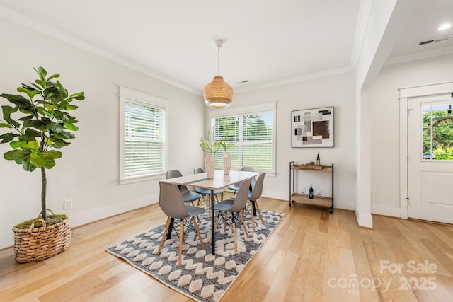 5305 Tarrywood Ln, Charlotte, NC 28205 - dining area featuring light wood-style flooring, crown molding, and plenty of natural light