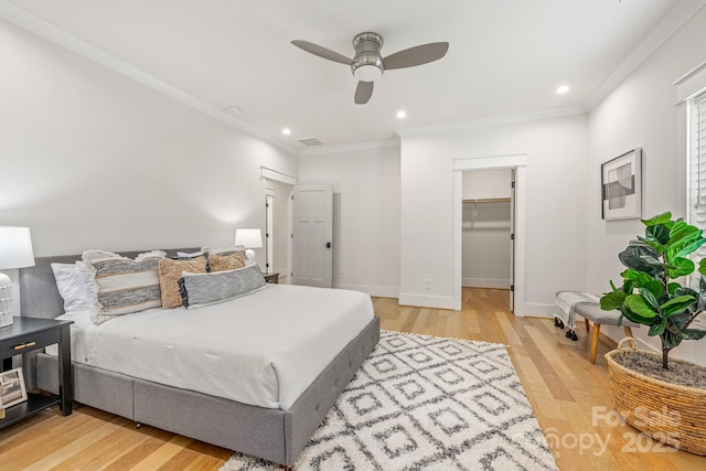 5305 Tarrywood Ln, Charlotte, NC 28205 - bedroom with light wood-type flooring, ornamental molding, recessed lighting, a walk in closet, and a ceiling fan
