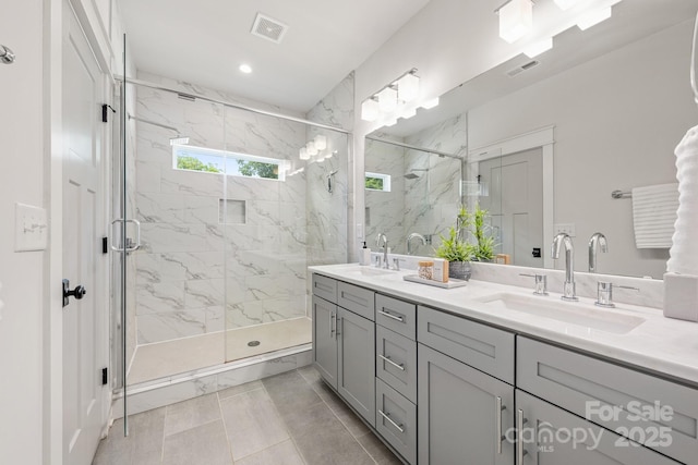 5305 Tarrywood Ln, Charlotte, NC 28205 - bathroom featuring double vanity, a marble finish shower, and recessed lighting