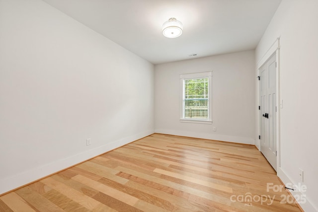 5305 Tarrywood Ln, Charlotte, NC 28205 - spare room featuring wood finished floors and baseboards