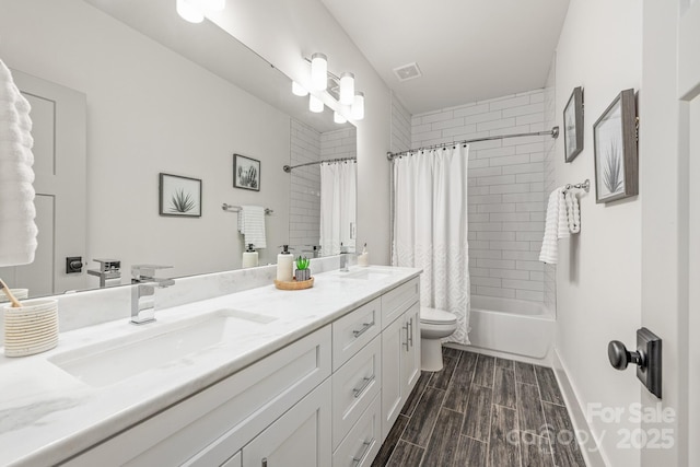 5305 Tarrywood Ln, Charlotte, NC 28205 - bathroom featuring double vanity, shower / tub combo with curtain, and wood finish floors