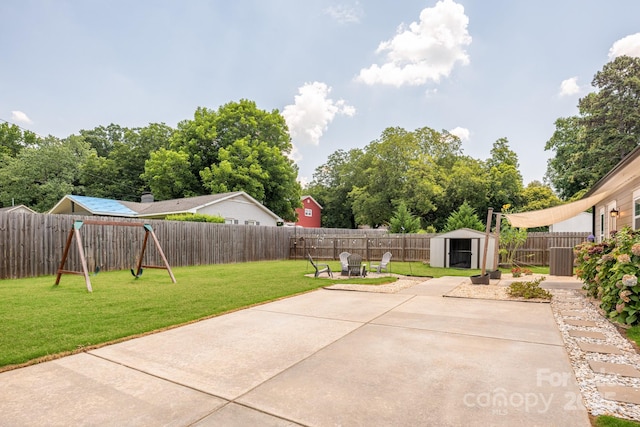 5305 Tarrywood Ln, Charlotte, NC 28205 - fenced backyard with a patio area, a shed, and a playground