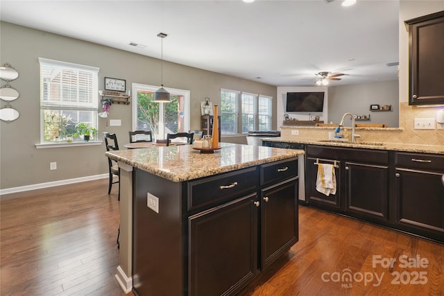 6029 Piscataway Ct, Rock Hill, SC 29732 - kitchen with a ceiling fan, dark wood finished floors, backsplash, and a peninsula