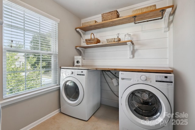 6029 Piscataway Ct, Rock Hill, SC 29732 - laundry area featuring washing machine and clothes dryer, plenty of natural light, and light tile patterned floors