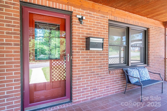 302 Planetree Dr, Belmont, NC 28012 - view of exterior entry featuring brick siding and covered porch