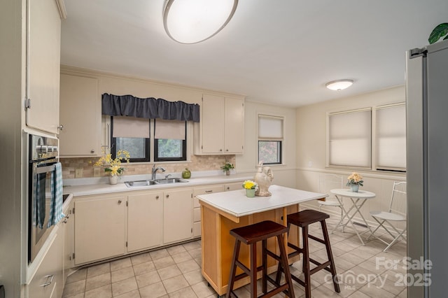 302 Planetree Dr, Belmont, NC 28012 - kitchen with light countertops, light tile patterned floors, and oven