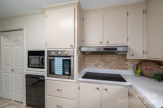 302 Planetree Dr, Belmont, NC 28012 - kitchen with black appliances, under cabinet range hood, light countertops, decorative backsplash, and light tile patterned flooring
