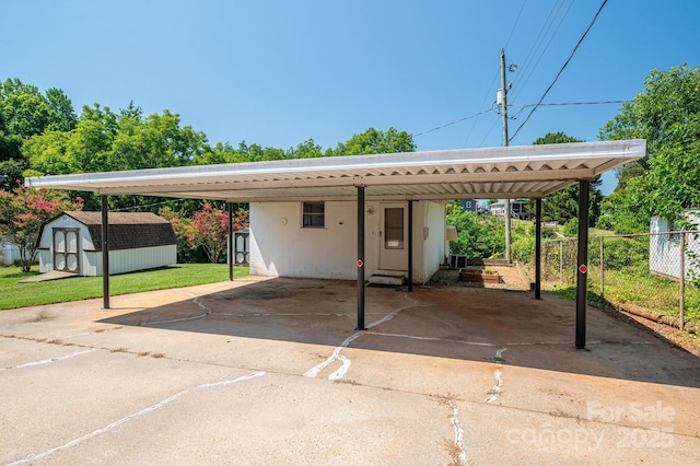 302 Planetree Dr, Belmont, NC 28012 - view of vehicle parking featuring a storage shed, a carport, and driveway