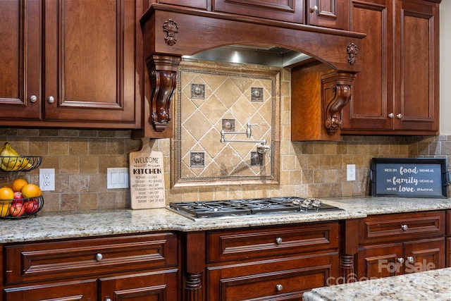 3211 Keady Mill Loop, Kannapolis, NC 28081 - kitchen with backsplash, stainless steel gas cooktop, and light stone countertops