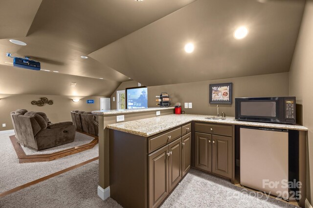 3211 Keady Mill Loop, Kannapolis, NC 28081 - kitchen featuring black microwave, refrigerator, light carpet, lofted ceiling, and open floor plan