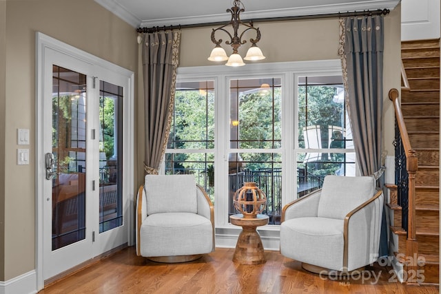 3211 Keady Mill Loop, Kannapolis, NC 28081 - living area featuring stairs, a chandelier, plenty of natural light, wood finished floors, and ornamental molding