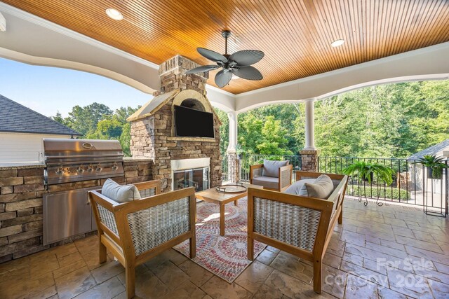 3211 Keady Mill Loop, Kannapolis, NC 28081 - view of patio / terrace featuring a ceiling fan, an outdoor living space with a fireplace, and an outdoor kitchen
