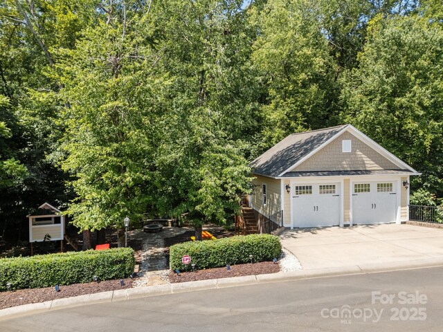 3211 Keady Mill Loop, Kannapolis, NC 28081 - view of front facade featuring a detached garage and stairs