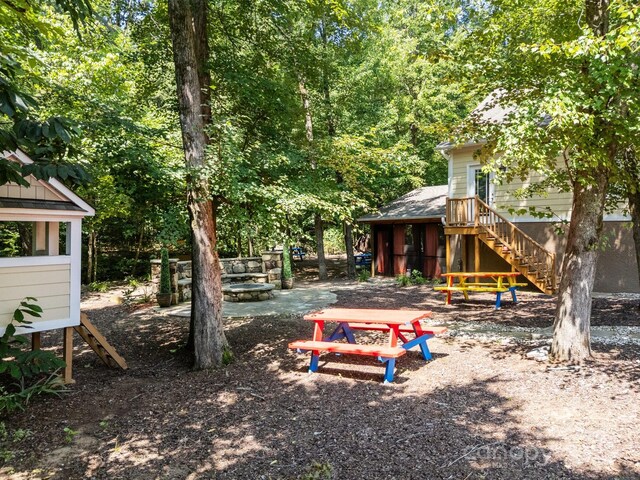 3211 Keady Mill Loop, Kannapolis, NC 28081 - view of yard featuring stairs and a fire pit