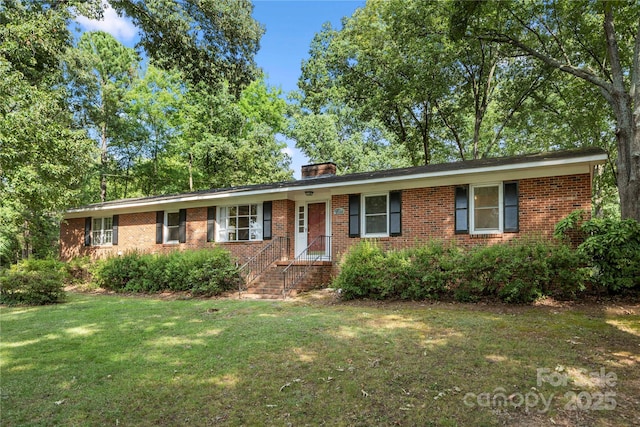 725 Plantation Rd, Lancaster, SC 29720 - ranch-style home with brick siding, a front yard, and a chimney