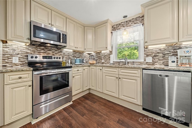 725 Plantation Rd, Lancaster, SC 29720 - kitchen with cream cabinetry, appliances with stainless steel finishes, and decorative backsplash