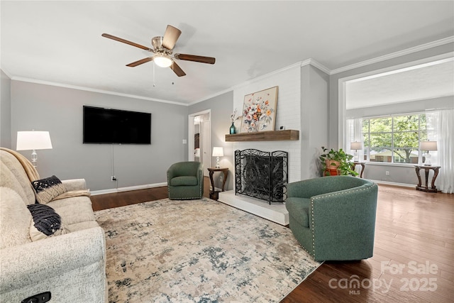 725 Plantation Rd, Lancaster, SC 29720 - living room featuring ceiling fan, a fireplace, wood finished floors, and ornamental molding