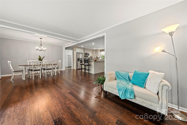 725 Plantation Rd, Lancaster, SC 29720 - living room with dark wood-style floors, ornamental molding, and a chandelier