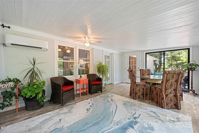 725 Plantation Rd, Lancaster, SC 29720 - dining space with an AC wall unit, wood finished floors, and a ceiling fan