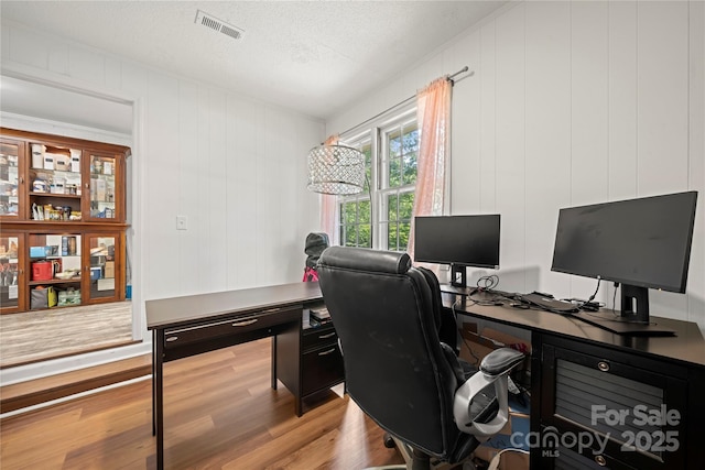 725 Plantation Rd, Lancaster, SC 29720 - office area with wood finished floors, a textured ceiling, and a decorative wall