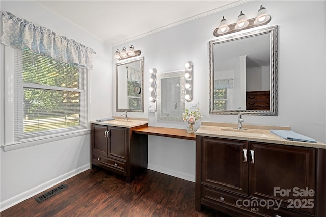 725 Plantation Rd, Lancaster, SC 29720 - bathroom with two vanities, wood finished floors, and crown molding