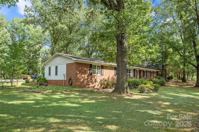 725 Plantation Rd, Lancaster, SC 29720 - single story home with brick siding and a front lawn