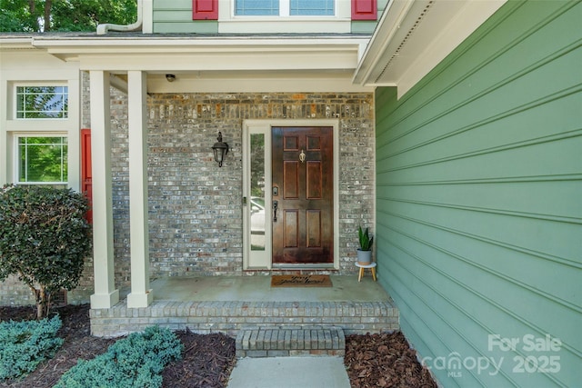 8909 Raven Park Dr, Charlotte, NC 28216 - view of exterior entry featuring a porch and stone siding