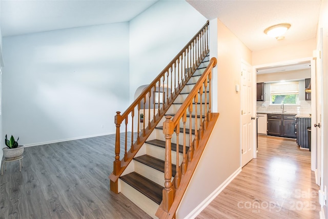 8909 Raven Park Dr, Charlotte, NC 28216 - stairs featuring wood finished floors and baseboards