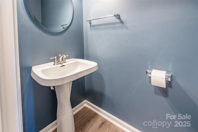 8909 Raven Park Dr, Charlotte, NC 28216 - bathroom with baseboards and wood finished floors