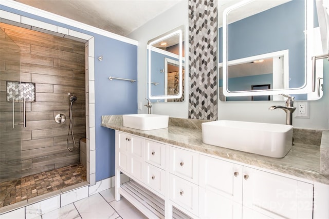 8909 Raven Park Dr, Charlotte, NC 28216 - bathroom featuring tiled shower, double vanity, and marble finish floors