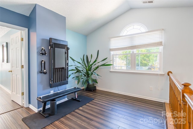 8909 Raven Park Dr, Charlotte, NC 28216 - exercise room with wood finished floors and lofted ceiling