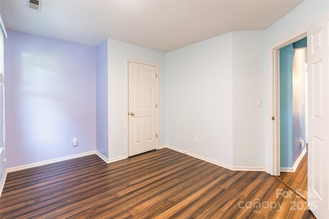 8909 Raven Park Dr, Charlotte, NC 28216 - unfurnished room featuring dark wood-type flooring and baseboards