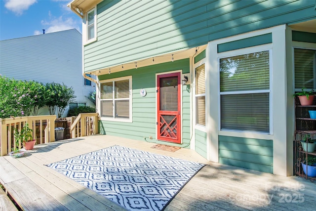 8909 Raven Park Dr, Charlotte, NC 28216 - view of exterior entry featuring a wooden deck