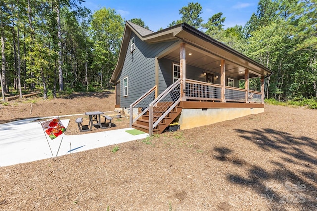 8333 Catawba Cove Dr, Belmont, NC 28012 - view of front of home featuring crawl space, a porch, and stairway