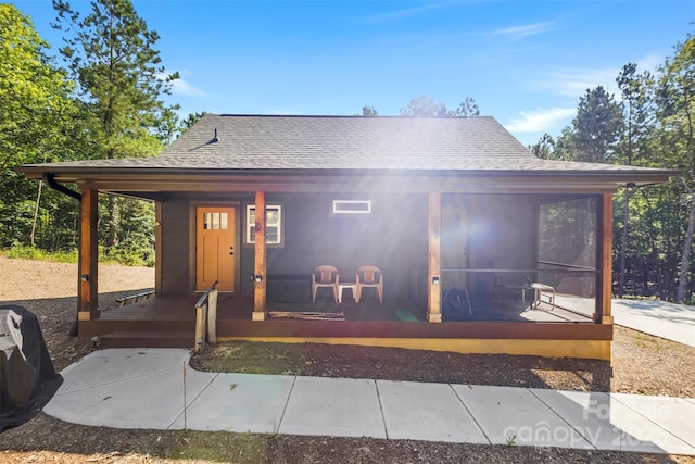 8333 Catawba Cove Dr, Belmont, NC 28012 - view of front of property with roof with shingles, a porch, and a sunroom