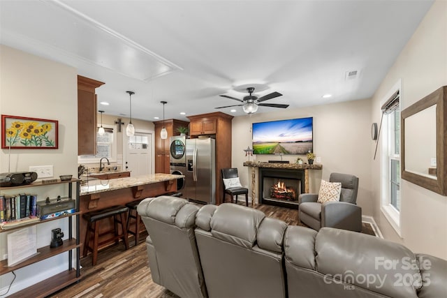 8333 Catawba Cove Dr, Belmont, NC 28012 - living area with wood finished floors, a lit fireplace, a ceiling fan, recessed lighting, and attic access