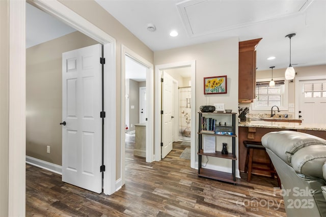 8333 Catawba Cove Dr, Belmont, NC 28012 - kitchen with dark wood-style flooring, light stone counters, pendant lighting, a breakfast bar area, and recessed lighting