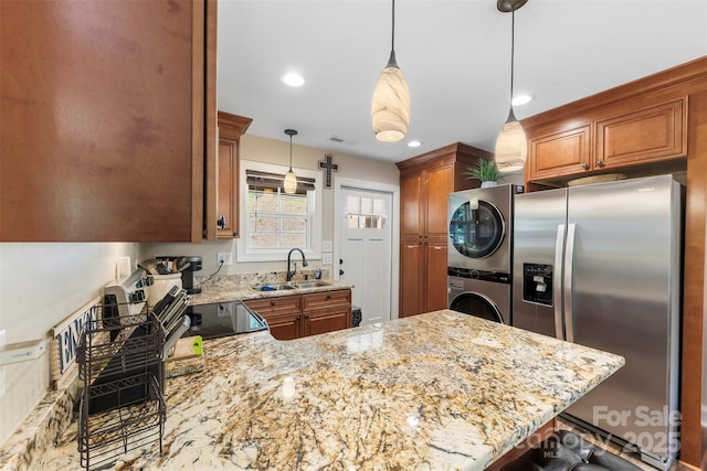 8333 Catawba Cove Dr, Belmont, NC 28012 - kitchen featuring stainless steel fridge with ice dispenser, stacked washer / dryer, electric range oven, a peninsula, and light stone countertops