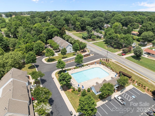 348 Tidmarsh Ct NW, Concord, NC 28027 - bird's eye view of a pool and a forest