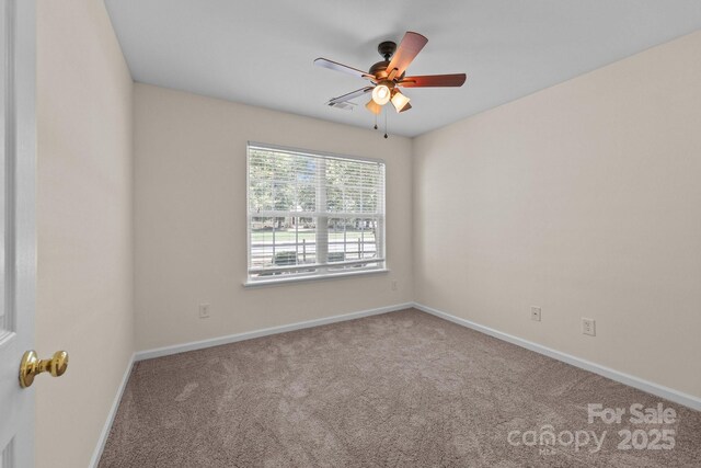 348 Tidmarsh Ct NW, Concord, NC 28027 - carpeted spare room with baseboards and a ceiling fan