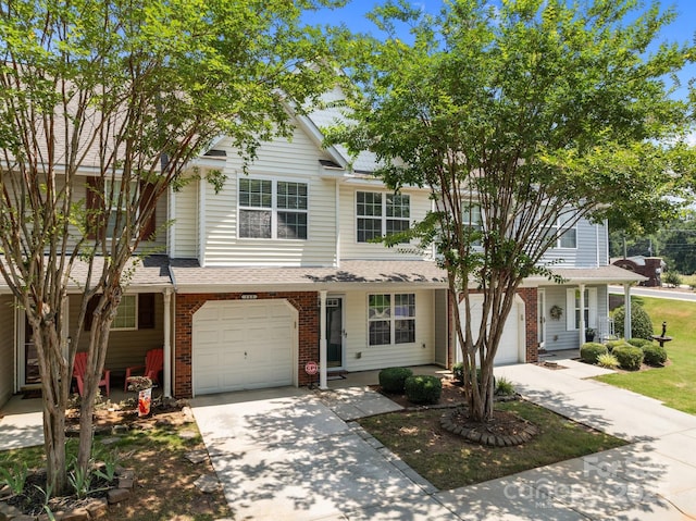 348 Tidmarsh Ct NW, Concord, NC 28027 - traditional-style house featuring driveway, a garage, brick siding, and a shingled roof