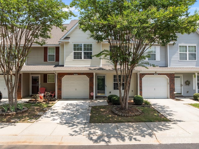 348 Tidmarsh Ct NW, Concord, NC 28027 - traditional-style home featuring concrete driveway, an attached garage, and brick siding