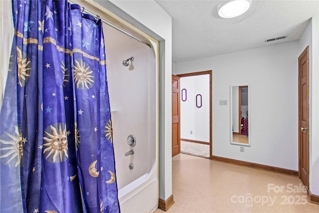 144 J And W Rd, Olin, NC 28660 - bathroom with a textured ceiling and shower / tub combo with curtain