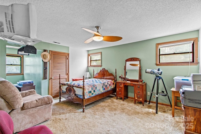 144 J And W Rd, Olin, NC 28660 - bedroom with a closet, carpet floors, ceiling fan, and a textured ceiling