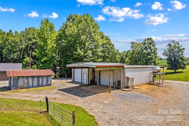 144 J And W Rd, Olin, NC 28660 - garage featuring a garage