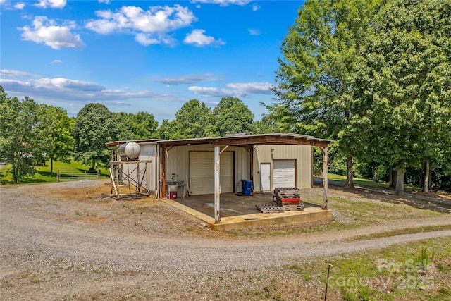 144 J And W Rd, Olin, NC 28660 - view of outbuilding with dirt driveway
