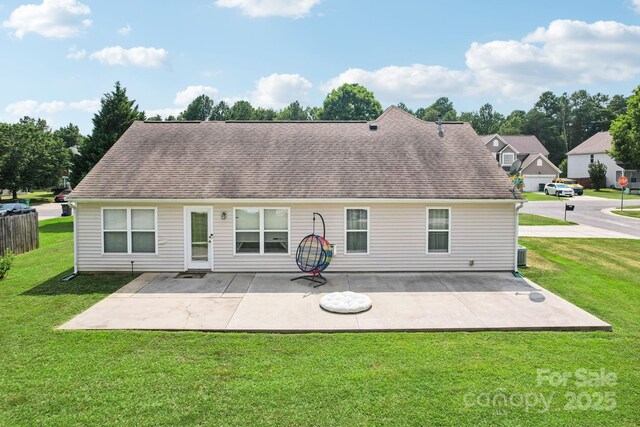 16009 Stuarts Draft Ct, Charlotte, NC 28278 - back of house featuring a lawn, a patio, and a shingled roof