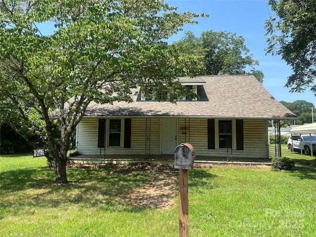 1014 8th St, Statesville, NC 28677 - view of front facade featuring covered porch, roof with shingles, and a front yard