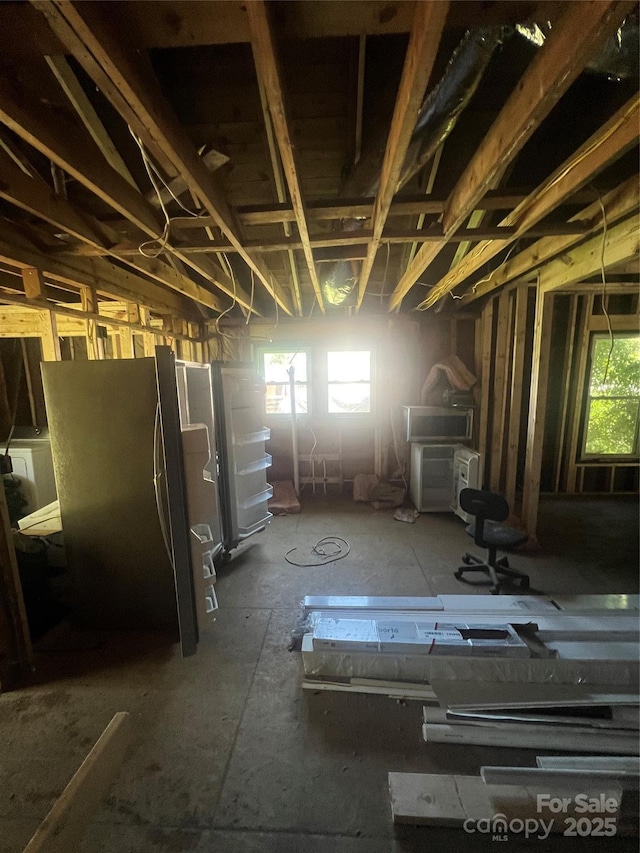 1014 8th St, Statesville, NC 28677 - basement with plenty of natural light and freestanding refrigerator